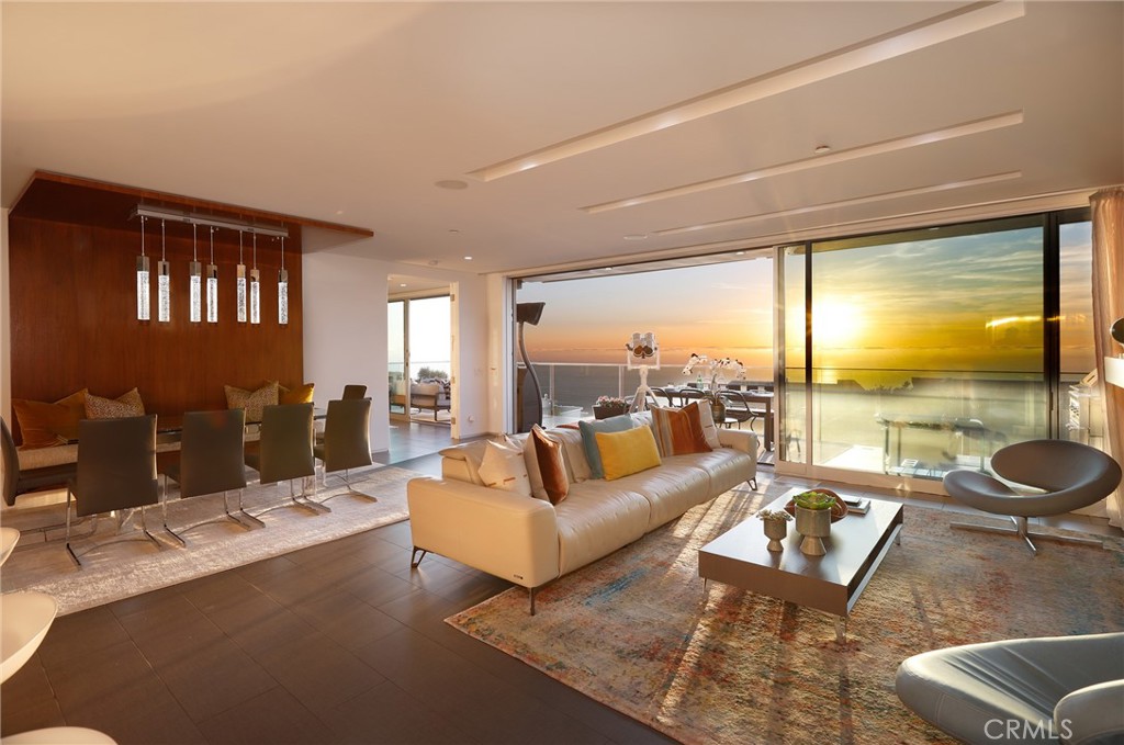 Just bring your suitcase!! Perched in the highly sought-after Arch Beach Heights of Laguna Beach, this exquisite 4 bedroom, 4.5-bathroom home spans 3,100 square feet, blending modern luxury, cutting-edge technology, and sustainable living with stunning ocean views. The gourmet kitchen stands as a culinary masterpiece, equipped with a Sub-Zero refrigerator and freezer, two additional Sub-Zero refrigerator drawers, and two Sub-Zero freezer drawers for added convenience. It features two 25-inch Gaggenau ovens, microwave, and a built-in coffee maker, ensuring an elevated cooking and coffee experience. Recently installed Miele dishwasher ensures effortless cleanup, while striking quartzite countertops with a dramatic waterfall edge add refined elegance. This home is fully automated with a state-of-the-art Control4 Smart Home System, allowing seamless control of lighting, motorized shades, security, climate, entertainment, and outdoor awnings from an iPad, mobile phone, or remote control. The integrated security system includes smart locks and alarms for peace of mind, while the whole-home music and entertainment system offers an immersive experience. Outdoors, the space is equally impressive with a re-tiled and re-plastered saltwater pool. The stucco exterior has been meticulously repaired, patched, preserving its classic charm, while driveway pavers and stonework have been resealed and re-stained to enhance curb appeal. Inside, the home exudes brand-new white plank luxury vinyl flooring chosen for durability and style, ideal for a poolside lifestyle. The bathrooms have been upgraded with new backsplashes, countertops, Toto toilets and more. The primary suite offers a sanctuary of luxury with exquisite Carrara marble finishes professionally sealed and honed for longevity, complemented by high-end Gessi fixtures and a Toto washlet toilet for ultimate comfort. Bonus features include a dry sauna in the fourth bedroom's bathroom and a soft water system and reverse osmosis filtration to provide the purest drinking water. With 32 Owned Solar panels and 3 backup battery units, the home is advanced and energy-efficient. Additional enhancements extend to the garage, upgraded with custom cabinetry and extra upper storage for maximum functionality and organization. From stunning ocean views to high-end finishes and advanced smart home integration, this exceptional Laguna Beach residence offers the perfect combination of luxury, comfort, and innovation.