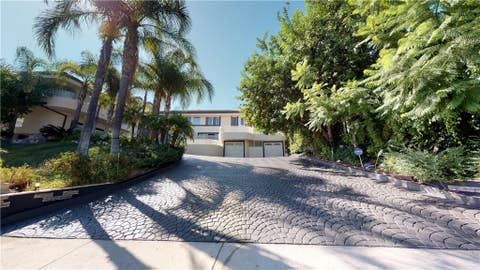 Photo of 22500 N Summit Ridge CIR, Chatsworth, CA 91311 (MLS # SR26182502)