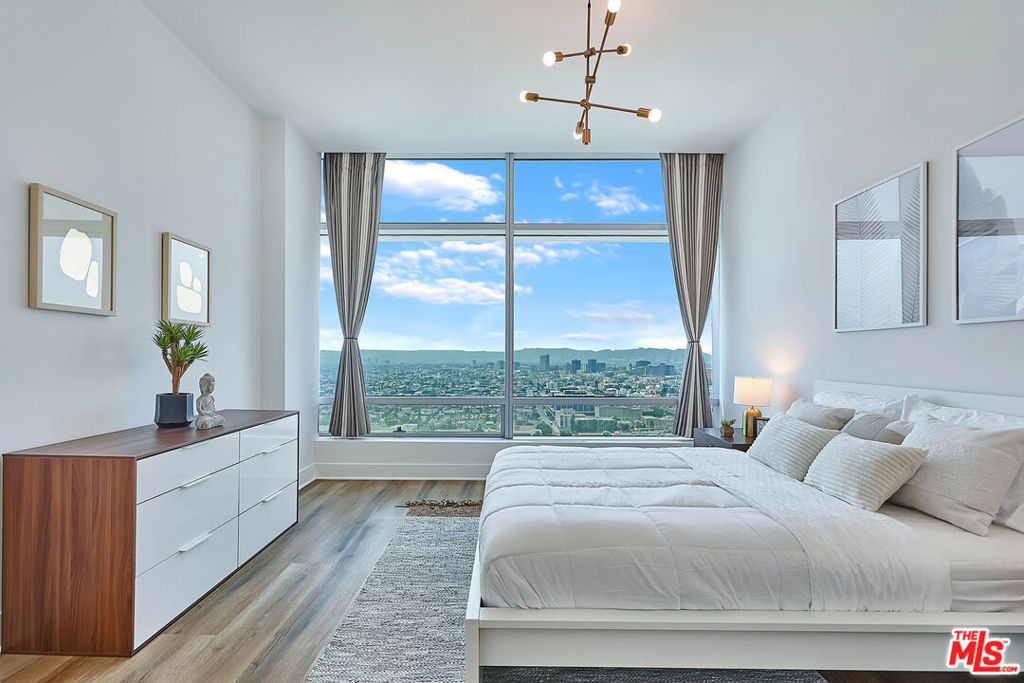 FURNISHED, WHITE GLOVE MODERN LUXURY CONDO AT THE RITZ CARLTON, You can live in the tallest and one of the most prestigious residential skyscrapers in Los Angeles. Come Be swept away on the 32nd floor of this Stylish and Chic 5 Star Condo at the very sought after Ritz-Carlton Residences LA. The epitome of luxury and success, this high end home is supreme. Recently remodeled, it is furnished updated most exquisitely. Light and Bright, highlights are the absolutely incredible views to the glimmering Pacific Ocean, stunning Mountain Range, famous Hollywood Hills, the Griffith Observatory and Hollywood Sign. This is the prime and favored view location of the building facing west. Daytime is absolutely gorgeous and the sunsets and twinkling lights at night are so superb. On the interior, your favorite features will be the custom wood beams, floor to ceiling windows, stylish gray kitchen cabinets, wide plank flooring, high ceilings and the gold and black finishes throughout. An upgrade is an added walk in closet in the bedroom as the plan originally only has 1 closet. This gorgeous building was designed by Gensler and built by AEG and is literally a dream residence for so many. Experience white glove services like a doorman, 24 hour security, housemen, valet, concierge, saltwater pool and bar and on-site Ritz Spa. This lifestyle is outstanding and delightful. Also walk to concerts, sport events, award shows and restaurants all within a short distance. A truly fantastic and exciting living experience. Treat yourself. Includes 1 valet parking. Small well trained pets may be considered. No Smoking or vaping, Excellent Credit and References are a Must. Requires Renters Insurance and tenant pays internet and electric. Will consider short term.