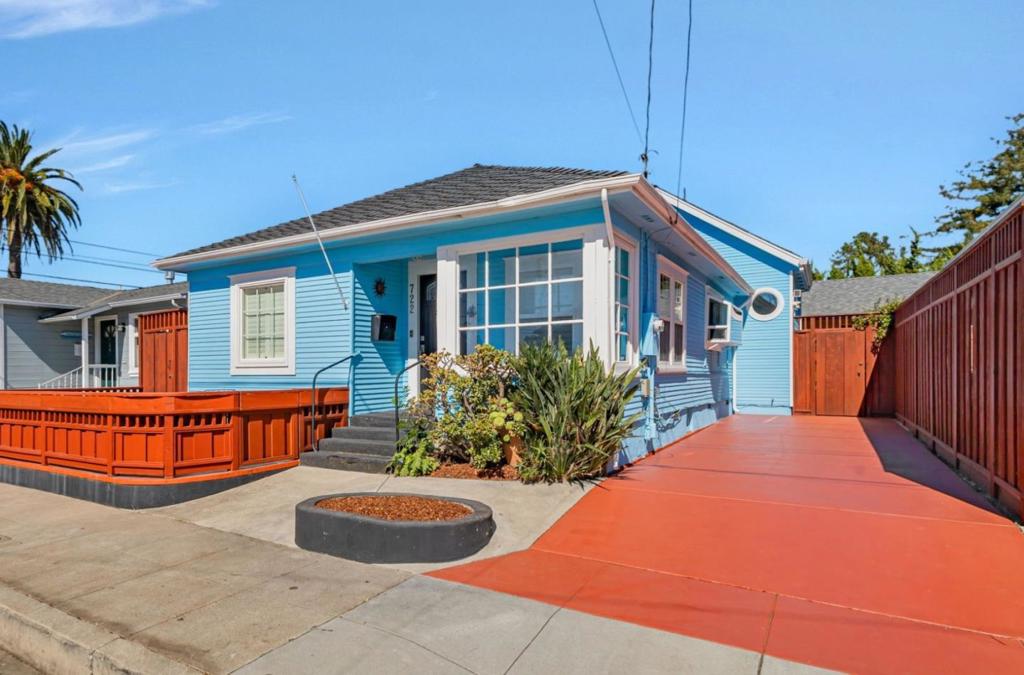 Welcome to this classic midtown bungalow nestled in the heart of Seabright, where charm meets the ultimate location! This delightful 3 bed, 2 bath home has been split into 2 units. The front functions as a 2 bed/1 ba. The inviting open floor plan boasts a modern kitchen with stainless steel appliances and breakfast bar which overlooks a bright sunny living area. Additionally, 2 bedrooms and a full bath provide ample room for friends & family. The thoughtful rear studio is perfect for guests, multigenerational living, or rental income, making the mortgage more manageable. Some standout attributes in the rear unit include a soaring ceiling, spacious loft bedroom, kitchenette, convenient laundry, built-in window bench, and French doors that access a serene, peaceful garden retreat. Enjoy the neighborhood from your front porch, or take a 5 minute bike ride to the beach, the Harbor, or downtown. Maybe take a quick stroll to some of Santa Cruz's best restaurants, shops, and entertainment. Run into friends and neighbors at the Friday night Midtown parties, see a show at The Rio, or listen to live music at the Crepe Place. So many options! Take advantage of this opportunity...enjoy 722 Cayuga as a 3 bd/2 ba home, or live in one and rent the other, or become an investor by renting both!