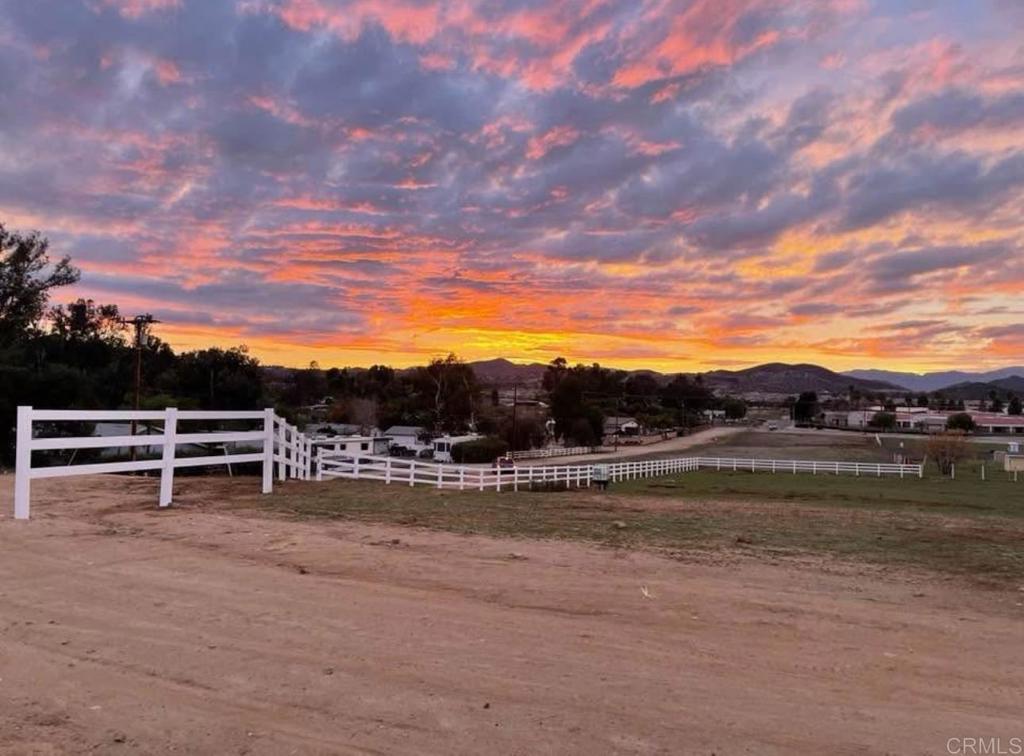 Live on a hill and enjoy stunning views of the countryside with breathtaking colored evening skies! The property is already equipped with water access throughout—ready to make someone's dream of country living a reality. It features a custom fence, stables, and a horse corral. Conveniently located near the 215 freeway, shopping, and schools. See Video Footage here: https://youtube.com/shorts/uxzDgZ6b2o8?feature=share