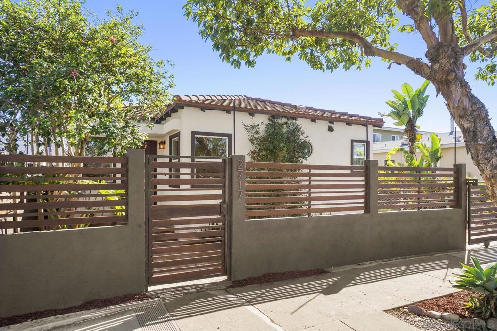 Timeless Spanish-Style Craftsman in Vibrant University Heights/North Park. 2 bed WITH A BONUS ROOM/OFFICE/BEDROOM. Nestled in the highly sought-after University Heights/North Park neighborhood, this stunning Spanish-style Craftsman home blends classic charm with modern curb appeal. With approximately $75,000 in renovations, this residence offers authentic Spanish tile, gleaming hardwood floors, and elegant arched niches that exude character. Its prime location near parks, restaurants, and freeways makes it ideal for those craving a walkable, vibrant lifestyle. Recent Upgrades: Fresh stucco (2021), roof maintenance (2024), and enhanced attic/wall insulation (2021) for superior energy efficiency. 240V outlet for car charging in the garage (2023), new water heater (2021), updated interior electrical (2017), and centrally ducted electric AC/heat (2017).Remodeled bathroom (2016) and a breathtaking kitchen with custom cabinetry (2017). Upgraded plumbing and sewer, pre-plumbed for an additional bathroom in the back office (2017).Modern exterior fencing installed. Recently painted, floors refinished. Enjoy the charm of a classic home with modern conveniences!