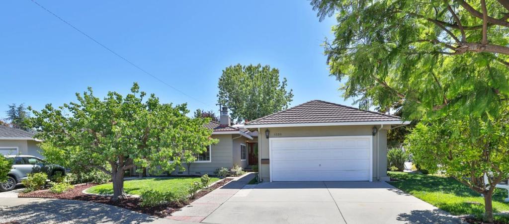 A perfect blend of sophistication, comfort, and opportunity nestled in the heart of Cupertino with access to top-rated schools and world-class amenities. This beautifully updated 4-bedroom and 2.5-bathroom home PLUS ~430 sq.ft. ADU showcase elegant hardwood floors, two fireplaces, and a seamless flow between formal and casual living spaces. The gourmet kitchen is a centerpiece, boasting professional-grade stainless steel appliances, a spacious island, a skylight, and custom finishes designed for both function and style. Set on an expansive corner lot in a quiet cul-de-sac with lush fruit trees and inviting outdoor sitting areas, the property is perfect for entertaining or unwinding in privacy. A thoughtfully designed ADU with its own kitchen, modern bathroom, and walk-in closet provides versatility for extended family, guests, or income potential.