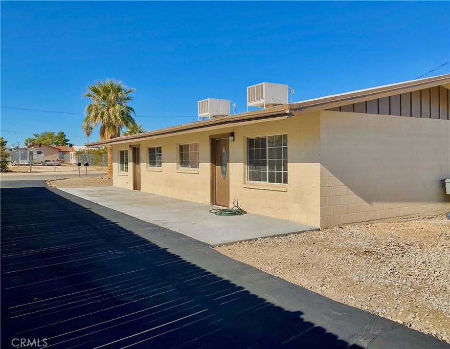 BEAUTIFULLY REMODELED DUPLEX IN THE HEART OF DOWNTOWN 29 PALMS!  This fully renovated duplex is a true gem...Upgraded from top to bottom with modern finishes and inviting style throughout.  Each unit features 2 spacious bedrooms and 1 upgraded bath, along with brand new paint and new flooring!   Every detail has been thoughtfully refreshed to create a clean, comfortable and move in ready space!  Located right in downtown, this property offers unbeatable convenience.  Walk to local shops, dining, and every day essentials.  Whether you're an investor looking for a turnkey rental or a buyer wanting to live in one unit and rent out the other, this duplex is an exceptional opportunity!!  Don't miss your chance to own this beautifully upgraded property in a prime location!!  Hurry and view today.