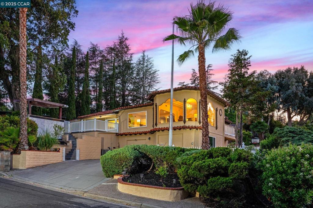 TWO HOMES IN ONE!! Rare Opportunity! PERFECT FOR MULTI-GENERATIONAL LIVING, 1031 exchange, large families, or rent out one part of the home and live in the other. The main home features 3 bedrooms and 2.5 baths. The spectacular living and dining rooms showcase Art Deco style with intricate crown molding, stately columns, gracefully arched windows with views and exquisite finishes. The chef’s kitchen is a dream for culinary enthusiasts—complete with a Wolf range, indoor grill, wok station, wet bar, and butler’s pantry. The family room has a wine fridge, bar area and cozy fireplace.. Perfect for entertaining. The primary bedroom is a true getaway with a bay window, walk-in closet and a spa-inspired ensuite. The lower level is a fully equipped 3-bedroom, 2-bath luxury dwelling—with its own entrance, garage with laundry, eat-in kitchen with a gas range, wine cellar, family room, and a private yard area. Enjoy summer in the resort-inspired backyard with a sparkling pool, covered patio, outdoor kitchen, firepit lounge area, and dedicated pool bathroom. Got Toys? Multiple garages and driveways provide ease, convenience and abundant storage. Located in the sought-after St Francis neighborhood. Close to parks, shopping and schools. This one-of-a-kind property is an exceptional find!