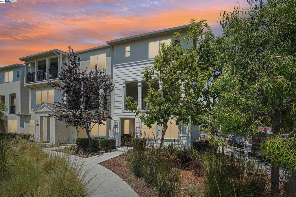 Contemporary Living at its best!...Spacious, Light & Airy, desirable Bayshores Corner Former model townhome(Strand), downstairs formal ADU/separate entrance. Spacious balcony, Views & privacy abound, lots of natural light, adjacent to community park & Clubhouse offering beautiful views & peaceful setting. Great Room has high ceilings,extended windows, recess lighting. Attractive floor plan offers 2191 sq ft hm, built 2018,4 bd/3.5 ba, downstairs spacious ADU perfect for guests/multigenerational living. Upgraded Kitchen features quartz countertops with full backsplash, island, stainless-steel appliances, built in pantry cabinets. Primary bedroom includes walk-in closet w/organizer(elfa) & serene ensuite. Features include dual zone central HVAC, recess lighting, tankless water heater, dual-pane windows, laundry room,RO system for drinking water. Finished 2-car garage w/epoxy floor,cabinets, sink, EV Charger, overhead storage. HOA includes FIBER high speed internet. Bayshores amenities -Clubhouse, BBQ area, picnic spots, park w/kids playground, Don Edward National Wildlife Refuge open space &trails. Near Farmers Market,Newpark Mall, Costco,Tesla, Meta,Amazon,880,84,Dumbarton Bridge, Freeways, Restaurants.