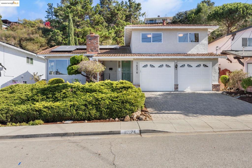 First time on the market in over 50 years! This spacious traditional home has "all the right rooms in all the right places". From the moment you step into the formal entry you'll notice the timeless beauty of hardwood floors. The large living room features a corner window overlooking the front garden. The eat-in kitchen is flanked by a dining room with a large arched window and an over sized family room that opens to the garden patio through French doors. A guest bath and laundry room are adjacent to the family room. Upstairs you'll find a primary suite as well as two additional bedrooms and a hall bath. Enjoy the comfort and safety of a two-car garage with interior access. Save on energy bills with your own solar panels! Look no further. This is the one!
