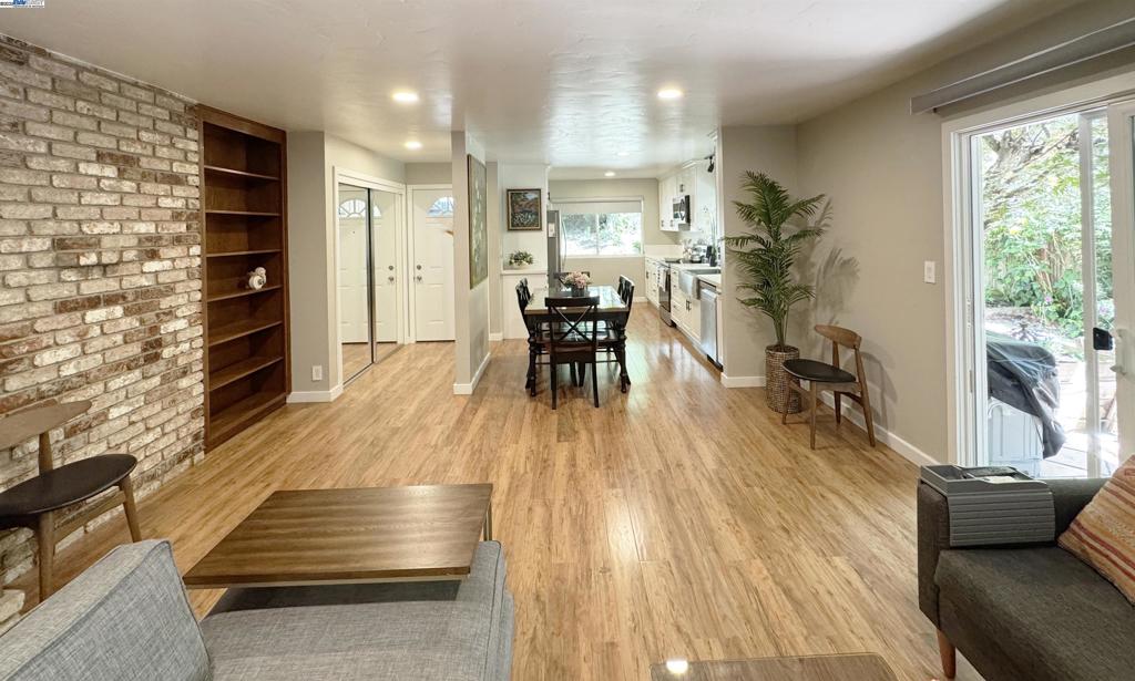 Step into this fully furnished, beautifully updated home where quality and care show in every detail. Nestled in nature, this residence offers the perfect blend of serenity and convenience. The current owner has thoughtfully renovated the entire unit, including installing new flooring and tasteful modern finishes throughout. The updated kitchen features stone countertops, stainless steel appliances, and soft-close cabinetry, all flowing seamlessly into the open living and dining areas. From the living room, step into your own fenced yard with a small covered patio and mature landscaping—a rare outdoor retreat for this complex. Both bathrooms have been tastefully redone with tile flooring and glass shower doors. The primary suite includes a built-in jewelry safe and generous closet space, with additional storage throughout the home. The layout is smart and efficient, maximizing both comfort and functionality. All of this is located just minutes from the Rheem shopping center, weekly farmers markets, scenic trails, Moraga Country Club, and St. Mary’s. And just beyond your backyard fence, enjoy convenient access to Rheem Elementary via a private staircase leading directly to the playground.