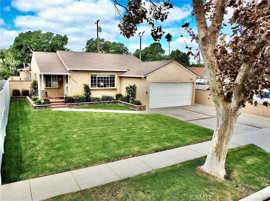 An exquisitely renovated 3 bedroom, 2 bathroom home featuring central AC, new roof, beautiful hardwood floors, crown moldings plus updated kitchen and bathrooms…  set amidst towering trees…  in Long Beach.  The expansive motor court driveway to the 2 car garage plus broad lawns, brick trimmed planters and a bricked reception landing afford a welcoming approach.  The moment you pass through the foyer you feel the casual graciousness and natural warmth of the living and dining rooms.  The sun filled kitchen with dramatic lighting enjoys an open view to the open beamed fireside family room with French doors to the secluded rear patio.  The front bedroom wing includes a guest bathroom, 2 bedrooms, one with a custom fitted closet.  The laundry room is convenient to the family room and secluded primary suite boasting a fireplace, walk-in closet, a private compartmentalized bathroom with shower plus French doors to the rear patio and grounds.  Privacy walls serenely enclose the enchanting party patio featuring a built in barbecue…  paved side yards plus a “tucked away” above ground covered spa.  Truly an amazing home and lifestyle opportunity…  in one of Long Beach’s most sought after neighborhoods!