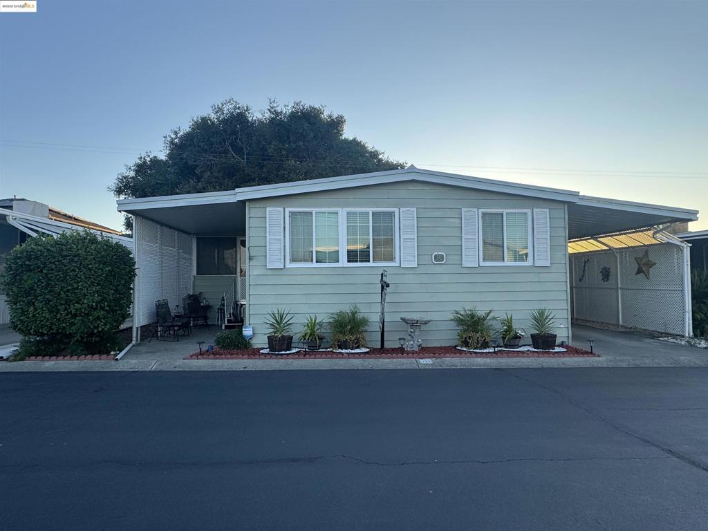 Beautiful Double Wide 3 bed 2 bath Mobile home located in desirable Eagle City Senior Mobile Home Park 55+ featuring community pool and club house. Drive up to this lovely mobile home on a wide street and nice curb appeal. Featuring large open and bright living and dining area. All new beautiful professionally installed SPC luxury flooring with 4 1/4" base boards. Freshly painted interior. Updated windows throughout most of this mobile Home. Enclosed sunroom porch adds for added space for relaxing, workout area, or extra space. Guest bath has wonderful walk in jetted tub perfect for easy entrance and therapeutic relaxation. Kitchen has plenty of cabinetry, new stainless steel range stove and dishwasher. Exterior offers siding with no skirting. Back yards is spacious with 4 sheds for added storage. Carport is covered for providing shade for parking under. Pest inspection done with a Clear Termite Report. Fireplaces: NO