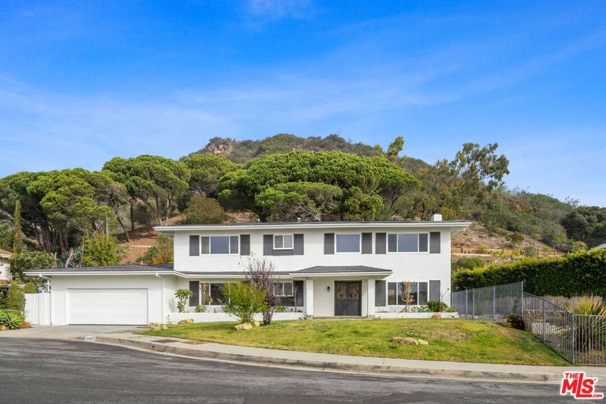 Located on a cul-de-sac in the sought-after Pacific View Estates neighborhood, this lovely 5 bedroom, 3.5 bath Traditional with pool and spa enjoys wonderful ocean and city light views.  The neighborhood fared extremely well in the fires, and this property is ready for occupancy.  Nevertheless, we reduced the price by $500,000, and opportunity knocks.  The home is approximately 3,158 square feet and is situated on a lot of about 25,574 square feet.  The lower level includes a living room with fireplace, formal dining room, spacious kitchen, laundry room, two baths and a large bedroom that can serve as a family room or fifth bedroom.  Terrazzo floors and steps lead to the upper level which includes 4 bedrooms and 2 baths, including two bedrooms with serene ocean views.  The rear and side yards are spacious, and the pool and spa area is ideal for outside entertaining.  Whether one chooses to move in or upgrade the home first, this presents a unique opportunity to live near the beach and enjoy the privacy and serenity of the Pacific View Estates neighborhood.