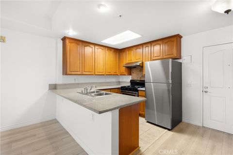 Photo of 17888 Alburtis Avenue #A102-2, Artesia, CA 90701 (MLS # PW25277096)