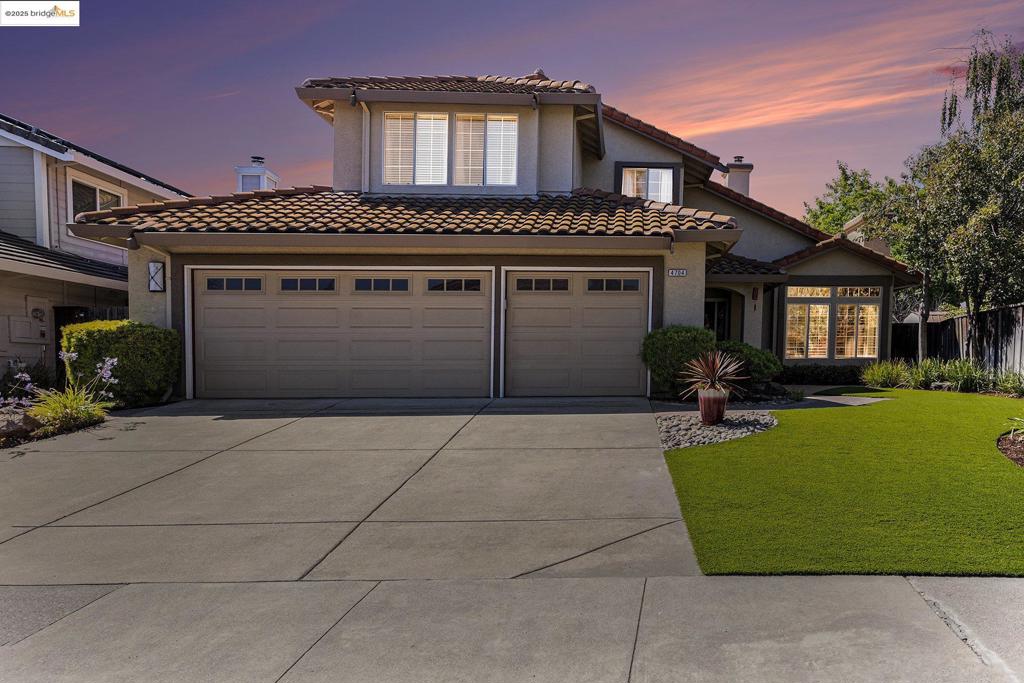 This beautifully maintained home offers comfort, style, and thoughtful upgrades throughout. Enjoy year-round efficiency with a newer HVAC system and water heater. Inside, you'll find two cozy gas fireplaces in the family and living rooms, plantation shutters for added elegance, and abundant natural light. The expansive primary suite offers a sitting area, reading nook or home office. The front yard features brand-new landscaping, while the backyard is a serene retreat with mature landscaping and a spacious covered patio—perfect for entertaining or relaxing. A rare 3-car garage provides ample storage. Located in a highly desirable neighborhood close to schools, parks, and shopping.