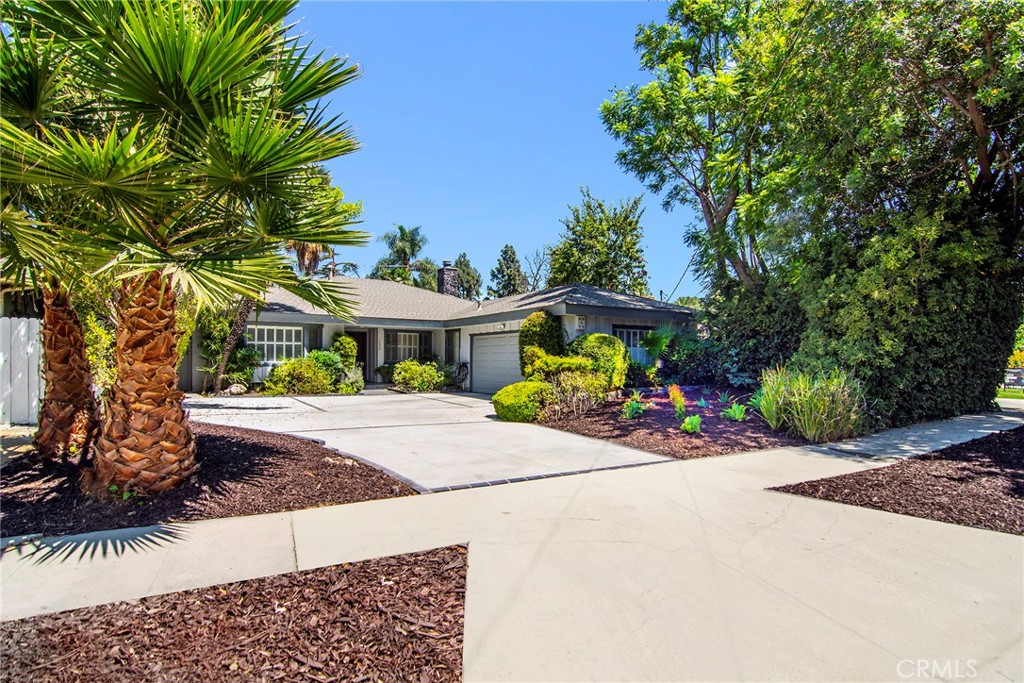 Come embrace this warm, wonderful pool home on an incredible quiet cul-de-sac situated in this sought-after Chandler Estates neighborhood of Sherman Oaks. Newer roof and large concrete drive deliver a pleasing first impression. Childhood memories of fun and frolic are certain to be created on this large concrete driveway & amazing serene street providing an ideal environment for enjoyment. Inside, a large living room with distinct stone fireplace and a unique lighted architectural ceiling accent is enhanced by beautiful vaulted wood beamed ceilings. An adjoining spacious formal dining room offers smooth ceilings and recessed lighting. Separate family room affords a cozy fireplace and classic wet-bar. Spacious and bright kitchen provides ample light wood cabinetry, granite counters, peninsula and an ideal breakfast area. At the east wing enjoy a secluded bedroom and bathroom. Your primary suite features a private bath with convenient rear yard access. Two additional bedrooms and a full bath add to the appeal. Outside, discover a large gated covered dining/entertaining arena that leads to a private rear yard with huge refreshing pool. Just down the street to Sherman Oaks Rec Center/park, brand new Trader Joes, Westfield Fashion Center & all the shops & yummy eateries that line the Blvd. Don’t miss!