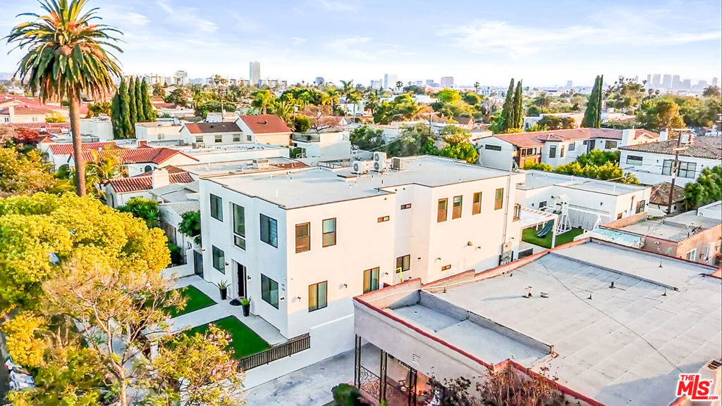 Welcome to 535 N Formosa Ave a stunning, newly built 2023 contemporary estate located in one of Los Angeles' most vibrant and desirable neighborhoods. This elegant two-story residence features six spacious bedrooms, seven luxurious bathrooms, and a detached 800 sq ft ADU with two bedrooms and two baths ideal for extended family, guests, or rental income. Step inside to dramatic high ceilings and a sun-filled open-concept living space. The gourmet kosher kitchen is a chef's dream, showcasing an impressive 14-foot island and top-of-the-line Sub-Zero appliances for the ultimate culinary experience. Throughout the home, you'll find elegant designer finishes and spa-inspired baths that perfectly blend style and comfort. Situated on a generous 7,700 sq ft lot, you're just minutes from renowned local temples, kosher markets, excellent schools, and the best of city living. Enjoy world-class shopping and dining at The Grove and Beverly Center, catch a movie in the historic Fairfax District, or explore the trendy boutiques and cafes of Melrose all right at your doorstep. Experience the perfect combination of modern design, luxury, and an unbeatable community atmosphere. don't miss this rare opportunity to own 535 N Formosa Ave!