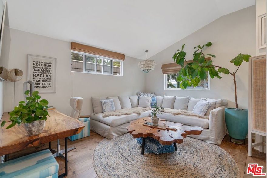 Amazing opportunity to own a completely custom 2br/2ba in the exclusive oceanside gated community of Paradise Cove for the price of a 1br. This coastal-chic dream home offers the perfect blend of luxury and comfort, whether as a full-time residence or a serene weekend escape. Overlooking one of California's most iconic beaches, this ground-up remodel is as breathtaking inside as it is outside. Gorgeous sculptural palms frame the entrance, welcoming you into a thoughtfully designed space where every detail has been carefully curated to maximize style and function. Wide-plank pine floors flow throughout, complemented by vaulted ceilings, dual-pane windows adorned with custom coverings, and recessed lighting that enhances the home's bright, airy feel. The open-concept live-work-dine space is centered around a perfectly proportioned kitchen with sleek quartz countertops, creating an inviting space for both cooking and entertaining. Both bedrooms are spacious, offering ample storage, while a cozy bonus sleeping loft, accessed by a stylish industrial ladder adds versatility and charm, complete with a separate storage area. The two beautifully tiled bathrooms showcase Carrera marble counters and modern fixtures, adding to the home's refined aesthetic. Outside, two adjacent parking spaces with additional room for a golf cart provide a rare and valuable convenience in Paradise Cove. An outdoor shower and dedicated surfboard storage make it easy to embrace the ultimate Malibu lifestyle. Residents of this exclusive community enjoy an array of exceptional amenities, including gated security for peace of mind, impeccably maintained grounds, tennis and basketball courts, a large clubhouse overlooking the ocean, a playground for the kids, and direct access to one of the most beautiful beaches in California. Offering a rare opportunity to own a meticulously redesigned retreat in one of Malibu's most sought-after locations, this home is a true slice of paradise.