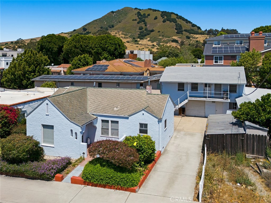 Charming Duplex in the Heart of Downtown San Luis Obispo! An incredible opportunity just blocks from vibrant downtown SLO! Situated on a large, versatile lot, this charming duplex offers immediate income potential and future development possibilities. The front unit features 2 bedrooms, 1.5 bathrooms, original hardwood floors, arched walkways, and a basement—blending vintage charm with functional living. The rear unit is a spacious 1 bedroom, 1 bathroom with its own private feel. Each unit is equipped with laundry for added convenience. A standout feature is the expansive storage space affectionately known as "The Warehouse"—perfect for a workshop, creative studio, or additional storage needs. With proximity to parks, restaurants, and all that downtown San Luis Obispo has to offer, this property is a rare find with endless potential.