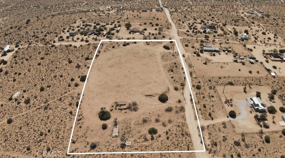 5 Acres | Covington Flats, Yucca Valley. Discover wide-open potential in the serene and sought-after Covington Flats area of Yucca Valley. This 5-acre parcel of raw desert beauty offers a rare mix of peace, space, and convenience. With power lines overhead (buyer to verify), this lot is primed for development—whether you're envisioning a weekend escape, a modern desert retreat, or a full-time homestead under the stars. Enjoy the rural, off-grid feel without sacrificing access: you’re just minutes from downtown Yucca Valley and a short drive to Joshua Tree National Park. Panoramic views, Unmatched tranquility. Fictitious address used to help locate property, All boundary lines in photos are approximate, Buyer to verify all utilities. Here’s your chance to plant roots in one of the High Desert’s most inspiring landscapes.