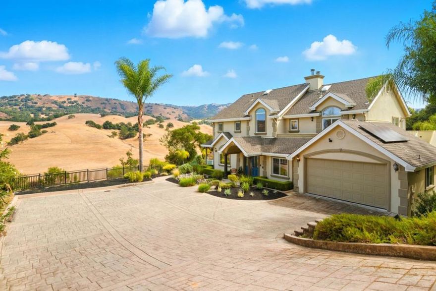 Staycation for sale! Rare opportunity to own a gorgeous custom home in prestigious Holiday Lake Estates adjacent to Anderson Lake Canyon & around the corner from Rosendin Park. Views of the hills & water are simply stunning from almost every room. Boasting nearly 4200 SqFt & nestled on a parklike 30,000 SqFt lot, this estate is ideal for multi-generational living. There are 3 bedrooms & 2.5 baths in the main residence, & the lower level ADU has its own entry with an additional bedroom, full bath, kitchen, dining area & living room. Inside you'll enjoy hardwood floors, architectural archways, 2 gas fireplaces, solar blinds, & views, views, views! Vaulted ceilings with oversized windows & fresh interior paint make things feel light, bright & spacious inside. There's also a separate wine room for your collection, & outside you'll find several balconies & patios plus an outdoor kitchen, hot tub, raised garden beds, & a picturesque gazebo where you can gaze at bald eagles & tule elk. In 2020, the owners invested over $110,000 into an 8kW solar system with 3 Tesla Powerwalls along with new heat pumps & air handlers for green friendly climate control. If you're feeling overwhelmed by the hustle & bustle of Silicon Valley, then 2983 Holiday Ct might be the perfect paradise to recharge!