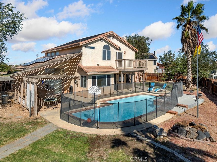 POOL HOME WITH SOLAR! This beautifully maintained 5-bedroom, 3-bathroom Victorville home features a solar-heated in-ground pool and a full solar system for energy efficiency. The backyard is perfect for entertaining and family gatherings, complete with a gazebo, built-in BBQ, extra storage shed, chicken run with chicken hut, and a drywalled, insulated space currently used as a gym—ideal for fitness enthusiasts. Inside offers 2,504 sq ft of living space, a spacious two-story layout, a comfortable primary suite, central heating and air, and a 3-car attached garage. This home truly blends comfort, efficiency, and resort-style outdoor living. Schedule your tour today!