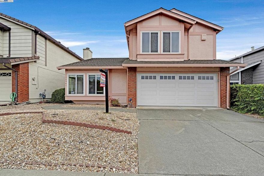 Beautiful 3-Bedroom, 2.5-Bath Home in a Quiet Neighborhood.  Step into a welcoming living room with soaring vaulted ceilings that create a bright and open atmosphere. The cozy family room features a charming brick wood-burning fireplace with a convenient gas starter, plus a sliding glass door leading out to the back yard—perfect for relaxing or entertaining.  The large, updated kitchen offers an abundance of cabinetry, granite countertops, a smooth-top stove with vent hood, dishwasher, and refrigerator, making it ideal for everyday living and cooking with ease.  Upstairs, both bathrooms are enhanced with recessed lighting.  Conveniently located near freeways, top schools, shopping, parks, and restaurants, this home combines comfort, style, and accessibility in one perfect package.    3D dollhouse: https://my.matterport.com/show/?m=iZBFbLqE7Rw