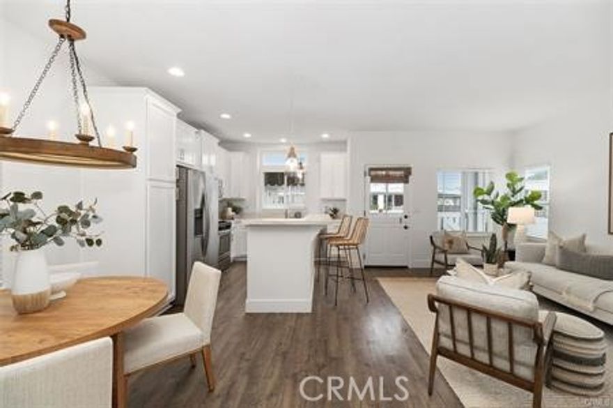 Welcome home to a beautiful turnkey 2 bedroom/2 bath cottage well located in Bayside Village in the heart of Newport Beach.  Step up to the front porch and door which leads you inside to the great room with turnkey kitchen, dining area, living space boasting high ceilings and lots of light from numerous windows.  You can step outside to the private patio yard or walk down the hall to the bedrooms, bathrooms and laundry room.  The master suite has lots of space & walk in closet, custom bathroom with built in cabinets.  There is a light and bright second bedroom and bathroom.  The laundry room has built in storage and doorway to carport. Living area has lots of windows and open kitchen with lots of cabinets, stainless appliances and an island.  Enjoy privacy  in the fenced patio yard. The carport has a lockable shed for your storage items.  Property has no one behind for additional privacy.
 Just a short stroll away is the pool/jacuzzi/clubhouse/fitness room/shuffleboard court/barbeque/and picnic area and a also nearby is Back Bay, marina, north clubhouse, private beach, dog park and an additional bayfront pool/jacuzzi. This is resort style living! UNDERMARKET LAND LEASE at $3024 monthly includes water, trash, sewer and numerous community amenities.  Come live the Newport Beach lifestyle at a fraction of the cost of surrounding neighborhoods.