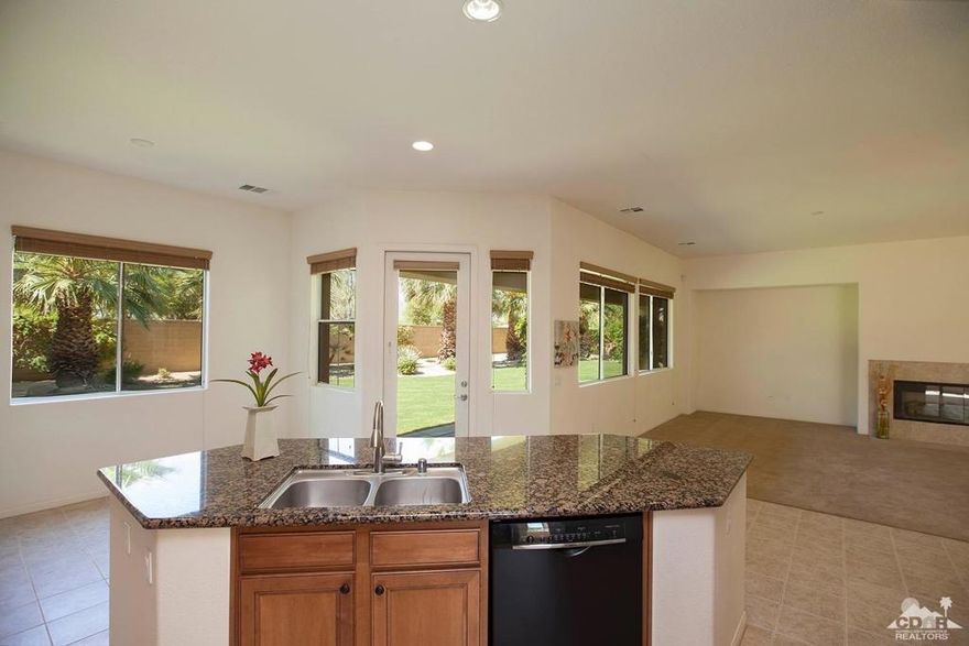 Extremely Rare 4 Car Garage! This property is a Must See! Pristine, Single-story home in the gated community of The Orchard. Premium 1/2 acre lot that has been professionally landscaped and offers unobstructed, southern mountain views from the backyard. This highly upgraded home is designed for todays's lifestyle with an open floorpan, spacious master suite, exquisite cabinetry, large pantry, slab granite kitchen counters and island. 4 bedrooms, plus a large bonus room, 3 bathrooms, and a huge 4 car garage. Centrally located close to restaurants, shopping, and more.