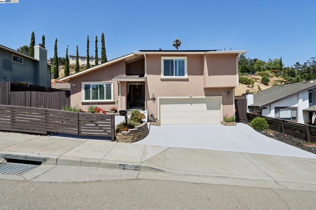 Tucked away on a quiet street in the highly sought-after Hayward Hills, this beautifully updated split-level home seamlessly blends comfort, style, and functionality. Step inside to a bright, airy living room with soaring vaulted ceilings and expansive windows that bathe the space in natural light. The modern kitchen is a chef’s delight, featuring granite countertops, a chic mosaic tile backsplash, stainless steel appliances, heated floors for cozy winter mornings, and ample cabinetry—plus a pantry for extra storage. Downstairs, you'll find a warm and inviting family room complete with a gas fireplace, perfect for movie nights or relaxing evenings in. Enjoy year-round comfort and energy efficiency with newer dual-pane windows and owned solar panels that help lower utility bills. The generous backyard offers endless possibilities—ideal for entertaining, gardening, or simply unwinding outdoors. With its size and layout, the space even offers potential for multiple ADUs, a rare and valuable opportunity. Don’t miss your chance to own this exceptional home in a peaceful, well-established neighborhood in the Hayward Hills!