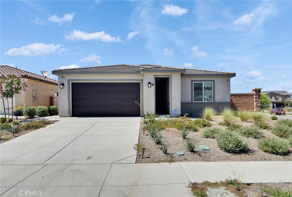 Welcome to this elegant 2024-built, single-story residence nestled in the Spring Mountain Ranch community of Riverside. Featuring 4 bedrooms and 2 full baths in approximately 2,090 sqft with modern upgrades and sustainable amenities. Inviting open-concept layout with soaring 9-ft ceilings, ideal for entertaining and family living. Gourmet kitchen with a center island, quartz countertops, white cabinetry, and Whirlpool® stainless-steel appliances. Stylish finishes throughout, including durable laminate flooring and recessed LED lighting with dimmers. Luxurious primary suite with dual sinks, walk-in shower, and generous closet space. Eco-conscious upgrades, including a solar energy system, low-flow fixtures, and smart insulation to help reduce utility costs. Outdoor living enhanced by an extended backyard patio and low-maintenance artificial turf for relaxation or entertainment. Situated in a scenic, well-maintained community known for trails, parks, and curbside sidewalk features. Only 10 minutes to UC Riverside, Downtown Riverside, and Loma Linda University & Medical Center, and 15 minutes to Mt.?Rubidoux Park and hiking areas. Zoned for Riverside Unified schools, with convenient access to Highgrove Elementary, University Heights Middle, and John W. North High.
