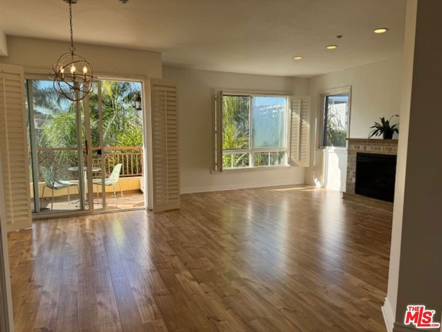 Beautiful bright 2 bedroom, 2 bathroom, front-facing unit bursting with natural light in a prime location!  A very spacious living room with decorative fireplace and private balcony with sunset views! Enjoy cooking at the gourmet kitchen with stainless steel appliances and granite countertops. Primary bedroom suite features a large walk-in closet, double vanity sinks, and separate soaking tub.  Enjoy hardwood floors, in-unit washer and dryer, central air conditioning, plantation shutters and recessed lighting throughout the unit.  2 assigned SIDE BY SIDE parking spots in a secure covered garage (with additional guest parking).  Excellent location close to Beverly Hills, West Hollywood and the Grove.  Walking distance to Cedars-Sinai, Beverly Center, and lots of great restaurants, cafes and shopping.