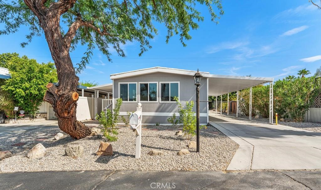 Welcome to your newly renovated oasis, a stunning mobile home that redefines modern living and invites you to step into a world of comfort and creativity! This beautifully crafted 2-bedroom, 2-bath gem boasts a brand-new kitchen that’s a chef’s dream, featuring sleek stone countertops and chic cabinetry that perfectly marries style with functionality. The new kitchen dazzles with a new whirlpool microwave, stove, and functional hardware that’ll inspire culinary delights, while the reglazed tub and new bathroom vanities and bathroom lighting add a touch of elegance to your daily routine. The open layout flows seamlessly, enhanced by a vibrant color palette that radiates cool vibes throughout. With new dual-pane windows bathing every corner in natural light, you’ll bask in the warmth and brightness of your surroundings. Discover luxurious upgrades, including new electrical outlets and switches, and convenient ceiling fans to keep you cool. Experience the ease of new laminate flooring complemented by white baseboard throughout. Every detail of this home has been meticulously crafted, from the new exterior paint and trim to the stylish awnings and refreshed stairs with outdoor carpet, creating a delightful first impression. Enjoy the benefits of a new central AC condenser and coil with a generous 10-year manufacturer warranty, ensuring your comfort year-round. The new landscaping invites you to embrace outdoor living, making this mobile home not just a place to live, but a lifestyle of harmony and convenience. Nestled in an all-age park with affordable space rent, your new community offers a sparkling pool—an ideal retreat for sun-soaked days. Don’t miss the chance to make this beautifully revamped space your very own sanctuary!