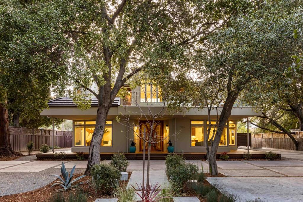 Behind gated grounds spanning over a third of an acre, this exceptional home blends luxury and livability with ample space for multi-generational living. Constructed with high-end steel and finished with top-tier materials, the home offers more than 4,500 square feet across three thoughtfully designed levels. Expansive formal rooms, a spectacular gourmet kitchen, an office, and a lower level with its own kitchen and living room are just a few of the standout features, while four en suite bedrooms ensure comfort and privacy. Outdoor spaces provide serene venues for entertaining or unwinding, and an additional bonus area of approximately 970 square feet includes a kitchen and three versatile rooms currently used as bedrooms. Conveniently located minutes from downtown Los Altos and The Village at San Antonio Center, this home is also close to parks, and within walking distance of acclaimed schools like Egan Junior High and Los Altos High (buyer to verify eligibility).