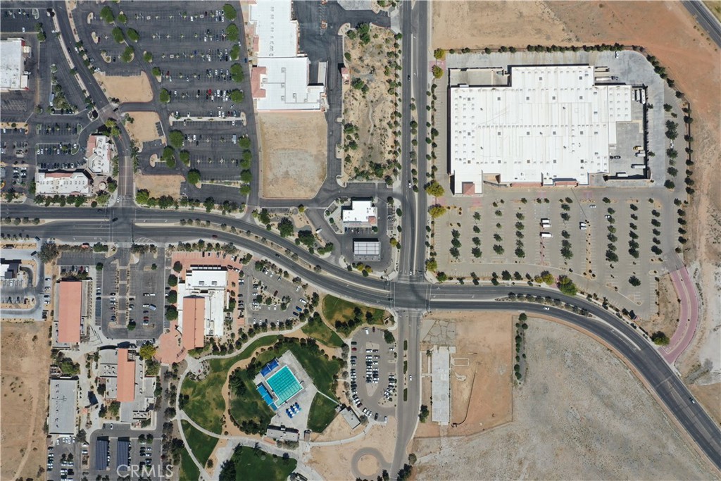 Prime 2-Acre General Commercial Corner Lot – Signalized Intersection
Incredible development opportunity in the heart of Apple Valley! This 2-acre General Commercial-zoned parcel sits on a high-visibility corner with a streetlight, just a short distance from the future Brightline West high-speed train station at Dale Evans Parkway.
Located across from the Target shopping center, Civic Center Park, Apple Valley Town Hall, the Sheriff's Department, and the public library, this site is surrounded by key civic and retail amenities. The area is experiencing rapid growth, making this an ideal location for retail, office, restaurant, or other commercial developments.
Take advantage of the expanding infrastructure and growth in the High Desert. This is a rare opportunity to build in one of Apple Valley’s most strategic and active corridors.