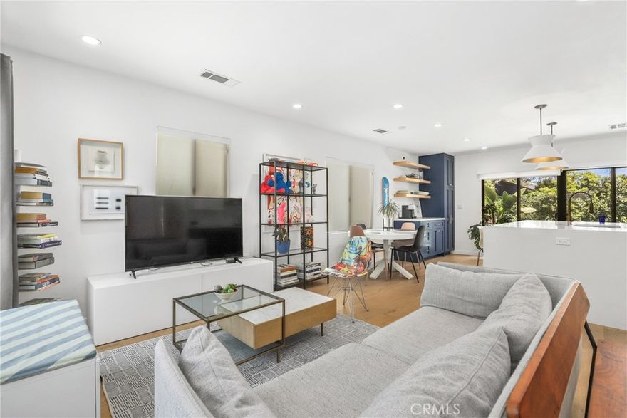 Proudly introducing this beautifully updated single-family residence with a permitted Junior ADU in one of Culver City’s most desirable neighborhoods. The main residence features 3 spacious bedrooms and a bonus room, and 2.5 bathrooms, highlighted by stunning oak wood flooring throughout the home. Enjoy an open-concept layout that seamlessly blends the living room, dining area, and chef-inspired kitchen—complete with a large quartz island with bar seating, subway tile backsplash, floating shelves, a pull out drawer pantry and cabinets, and newer stainless steel appliances. The primary suite offers comfort and functionality with dual closets (including a walk-in), French doors leading to the backyard, and a luxurious en-suite bathroom featuring a glass-enclosed shower, designer soaking tub, and a rainfall showerhead. Other features include spacious secondary bedrooms, additional FLEX room that could be a bedroom or office and Tesla charger in 2 car driveway! The attached Junior ADU with separate address, built in 2023, offers a modern living space with its own kitchen, full bathroom, skylight, recessed lighting, built in AC/heater unit, and separate electrical/ water service—ideal for guests, rental income, or a home office. Outside provides your private backyard oasis with a PEX finished patio and a newly done modern landscaping that features a lush garden filled with mature fruit trees and beautiful herb garden —including  fig, pomegranate, apricot, peach, passion fruit, citrus trees, lemon, orange and abundant lavender and rosemary bushes with raised garden beds for grow-your-own vegetable garden. A separate shed provides additional storage. Located in the sought-after award-winning Culver City School District and near El Marino Language School, you are also moments away from Sony Studios, Google Campus, Silicon Beach,  Westfield Mall , Fox Hills, Downtown Culver City, Playa Vista , Whole Foods, Traders Joe's and much more. This tree-lined neighborhood with charming Magnolia trees offers an unbeatable combination of quality lifestyle and convenience.