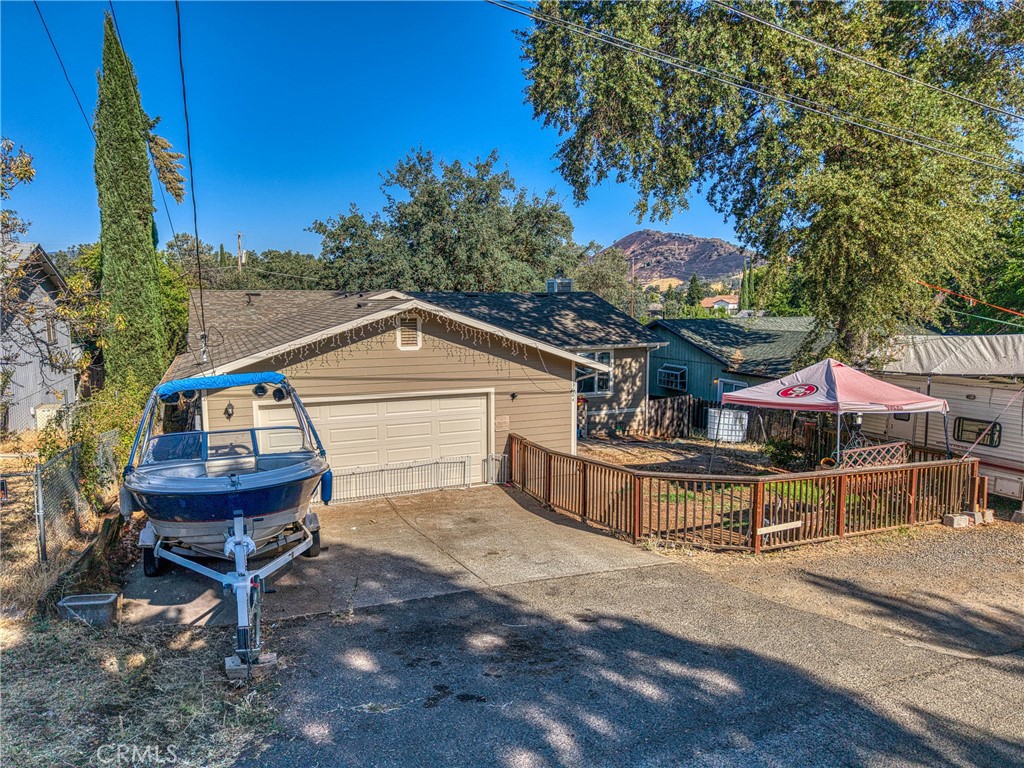 This fully renovated home offers modern upgrades with a spacious layout, just minutes from the shores Clearlake and recently redesigned Austin Park. Nearly everything has been redone including new bathrooms, electrical, insulation, drywall, trim, doors and a fully rebuilt garage. A brand new HVAC system with all new ducting ensures year round comfort.
Inside, the open floor plan connects an updated kitchen, dining area and living room warmed by a wood stove. A 12 x 20 bonus room expands the living space with high ceilings and large windows that look out over the backyard. Bedrooms are generously sized and both bathrooms have been updated with the main bath featuring a soaking tub.
The exterior features new windows, fencing, fresh attic insulation and updated systems throughout. The large driveway with two car garage provide ample parking for cars, boats or RVs which is ideal for life in Clearlake. Out back, a tiered deck offers plenty of space for entertaining under mature trees while under house storage adds extra utility.
This property sits in a quiet neighborhood with views of Mt. Konocti and easy access to shopping, dining and the lake. The home has essentially been rebuilt from the ground up and is move in ready for its next chapter.