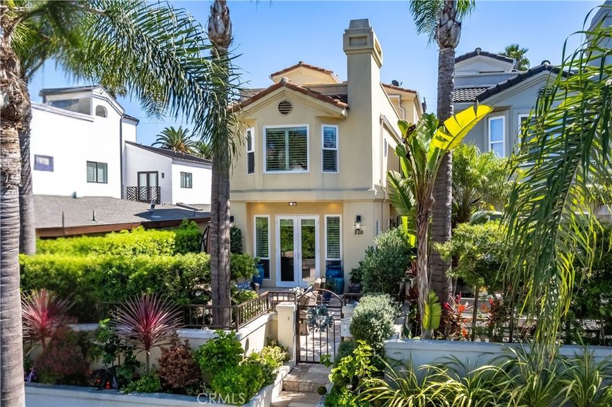 Embrace the best of coastal luxury in this beautifully updated Downtown Huntington Beach residence, offering nearly 3,000 square feet of refined living just steps from the sand, dog beach, and the vibrant downtown scene. Fully renovated from top to bottom, this elegant home features three spacious bedrooms with in-suite bathrooms that have been fully remodeled, a bonus room with a full bath (easily converted to bedroom #4), and a layout designed for effortless indoor-outdoor living. The main level welcomes you with a cozy living room and fireplace with built-ins that open to a private, landscaped front patio with soothing fountain, custom lighting and perfect for enjoying ocean breezes. The open flow continues through a formal dining area into a gourmet kitchen with premium stainless steel appliances, a center island with bar seating, a walk-in pantry and an adjoining family room ideal for entertaining. Upstairs, the expansive primary suite provides a serene retreat with its own fireplace, dual closets, and a spa-inspired bath with dual vanities, a soaking tub, and a walk-in shower. Two additional en-suite bedrooms with large closets and a convenient laundry room complete the second floor. The third level features a versatile bonus room with its own fireplace and full bath that opens to a rooftop deck showcasing sweeping panoramic views, creating the ultimate entertainer’s setting. Additional highlights include an attached two-car garage with direct access to the kitchen, thoughtful upgrades throughout, and a turnkey layout designed for modern coastal living. This rare offering places you just blocks from the ocean, with world-class shopping, dining, and endless outdoor recreation all at your doorstep.
