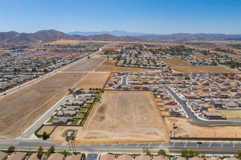 This parcel is just north of a small pocket development on Phyllis, It is across the street from The Club Development, a gated 55+ project and just south a large DR Horton Sagewood Development. This block walled parcel is zoned LDR-2 for 7200sqft lots making this parcel potentially a 20+ lot development. This parcel is on a paved lot with utilities in the street. Per Menifee Website, Current allowable uses include Single Family, Duplexes, Multiple Family, Manufactured Homes, Family Day Care, Accessory Dwelling Units (ADU), Group Residential Homes & Homes with Guest houses. Owner will carry 80% 1st td @ 6.5% interest only, 5 years with no prepayment penalty and no subordination.