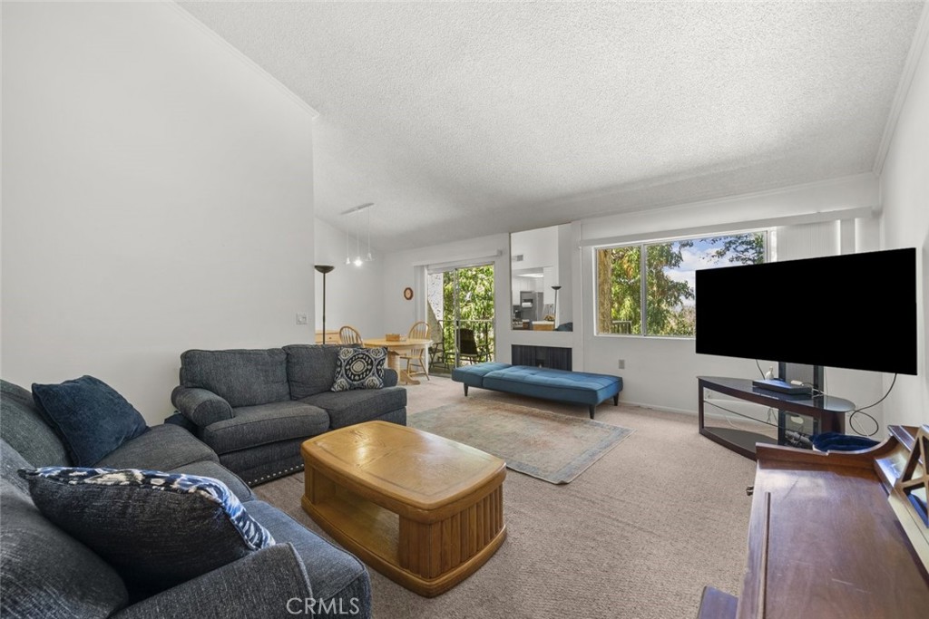 Welcome to 1814 Garvey Avenue, a bright and spacious 2-bedroom, 2.5-bathroom condo offering 1,194 sq ft of comfortable living in a well-maintained Alhambra community. This multi-level unit features high ceilings, abundant natural light, and a cozy fireplace in the living room, creating a warm and inviting atmosphere. Enjoy outdoor relaxation on your private balcony, and appreciate the convenience of an attached 2-car garage with direct access. The home offers carpet flooring throughout, generous living spaces, and a functional layout perfect for both everyday living and entertaining. The community boasts desirable amenities including a sparkling pool and spa, providing the perfect place to unwind. Ideally located near shopping, dining, and commuter access, this condo blends comfort, convenience, and value in the heart of Alhambra.