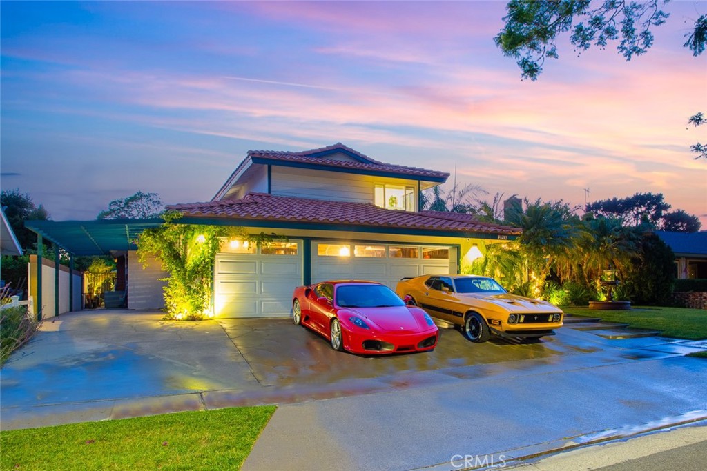This HGTV-inspired remodel is a one-of-a-kind retreat tucked away in a highly desirable cul-de-sac, just minutes from the historic Orange Circle.
The home’s exterior welcomes you with a dramatic Spanish-style fountain framed by lush tropical landscaping and uplighting for an enchanting nighttime ambiance. A sparkling swimming pool with above-ground jets makes the backyard feel like a resort getaway.
Inside, every detail has been carefully curated. Incredible handmade Spanish terra cotta floors flow throughout, accented by hand-painted custom Spanish tiles both inside and out. The kitchen showcases a marble diamond-pattern backsplash, a custom-converted wine barrel sink, and Moroccan hand-hammered stamped faucets — truly unique artisan features. Bathrooms have been completely remodeled with modern finishes, including elegant lighting and backup LED features for added convenience.
Two large living and family rooms provide ample space for entertaining and everyday living, while custom finishes throughout add warmth and character. The home is fully equipped with premium appliances, including a Samsung Smart TV refrigerator.
For ease of living, pool service and lawn care are included.