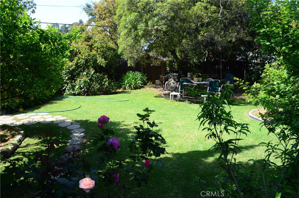 Once and Future Oasis on a Private Street. This large flat lot sits far off the main road on a private lane. The former home was well known for its quiet seclusion and lush hedgerows offering intimacy and solitude. Previously, the structure of the main house stood at 1667 sqft with an additional garage, allowing for new expedited development of a comfortably sized home. Totaling over 11,000 sqft, this property has ample room for a home, guest home, garage, and useable yard space. With completed phase 1 and 2 clearance by the ACOE the only thing that remains is your imagination and heart to bring new life to this unique corner of a city in the midst of rebirth. This home was destroyed in the Eaton Canyon Fire and is being sold as land only. Buyers are advised to independently verify all aspects of the property including but not limited to contamination, feasibility, and future use.