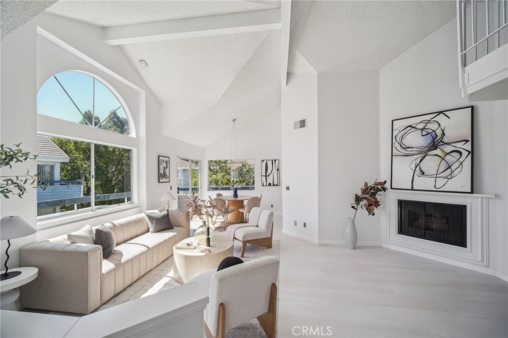 Welcome to 26970 Flo Lane, Unit 310, a beautifully updated condo in the heart of Santa Clarita. This light-filled home offers 2 bedrooms, 2 bathrooms, PLUS A VERSATILE LOFT—perfect as a home office, guest space, or reading nook. The open living area features soaring ceilings, brand-new designer flooring, and fresh paint throughout, creating a modern and inviting ambiance. The remodeled kitchen boasts stylish finishes and a full suite of brand-new, never-used Samsung appliances. The primary suite offers a private retreat, while the attached tandem 2-car garage provides convenient parking and extra storage. Enjoy resort-style living with community amenities including a sparkling pool, spa, tennis courts, playground, BBQ area, and beautifully maintained grounds. Located near shopping, dining, and major highways, this home blends comfort, style, and convenience in one desirable package.