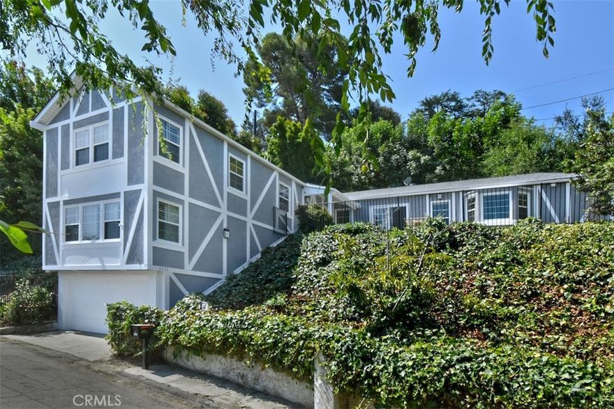 Nestled in the hills of Studio City, South of the Boulevard, this remodeled 3-bed, 2-bath home offers panoramic mountain and valley views. The open floor plan features a light-filled living room with a fireplace, built-ins, and large windows. The spacious kitchen boasts a central island with seating, stainless steel appliances, ample cabinets and countertops and a wonderful bay window. The private primary suite offers a tranquil retreat with a beautiful spa-like bathroom featuring double sinks, a soaking tub, a shower, and a walk-in closet. The versatile downstairs family room, complete with a fireplace, can serve as an office, playroom, or guest room. Located in the Carpenter School District, this delightful home provided easy access to all that Studio City has to offer, including shops, restaurants and entertainment studios.