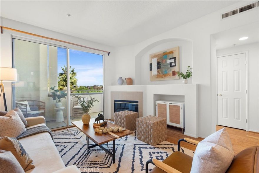 Welcome to Catalina.  A highly sought-after top-floor, corner penthouse residence featuring 3 bedrooms and 2 bathrooms. Located directly across from Concert Park, the unit offers a bright and airy layout with central AC and heating, and a convenient in-unit stackable washer and dryer. The kitchen opens seamlessly to the dining area and includes a breakfast bar, perfect for casual meals or entertaining. Enjoy engineered wood flooring throughout the main living areas and kitchen, complemented by newly installed plush carpet in the bedrooms for added comfort. From the living area, you have direct access onto a sizable private balcony, with unobstructed city and mountain views. Additional highlights include side-by-side parking with personal EV charging, as well as personal storage lockers above each parking space. Enjoy everything Playa Vista has to offer, including The Resort and The Center Pointe Club, featuring multiple pools, state-of-the-art gyms, parks, sports courts, soccer fields, playgrounds, dog parks, and more. A short stroll or PVCS Bus ride takes you to Playa Vista Elementary, Concert Park, and Runway Village, home to shops, restaurants, entertainment, Whole Foods, CVS, and medical offices. Experience the best of Playa Vista living at Catalina!