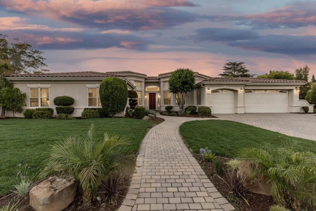 Nestled in Saratogas Golden Triangle, this 2001-built residence blends high ceilings contemporary transitional style. Close to award-winning Argonaut Elem., Redwood Mid., Saratoga High, minutes from Saratoga Country Club, Westgate Center, Saratoga Farmers Market,& Hwy 85. Greeted by the entry door with sidelight, transom window, & turret-style library with built-in bookcases. Inside are windows with plantation shutters & recessed lighting, fireplace with mantle & decorative columns. A turret-style dining area. The kitchen has white cabinetry, granite counters, a dry bar, & premium stainless steel appls: KitchenAid refrigerator, brand new KitchenAid double oven, Miele cooktop, under-cabinet range hood, & LG dishwasher. The family has cozy fireplace, custom cabinetry & direct backyard access. The primary suite has its own backyard access, 2-way fireplace, walk-in closet,& spa-like bath featuring a double sink vanity, frameless walk-in shower, jetted tub & water closet. 3 additional bedrooms, including 1 ensuite with a private bath. A hallway bath with a shower & tub, & powder room, skylight, & built-in desks. A dedicated laundry area, 3-car garage & backyard with 2 waterfalls, swimming pool, raised spa spillover & fire pit. All in one of Silicon Valleys most desirable neighborhood.