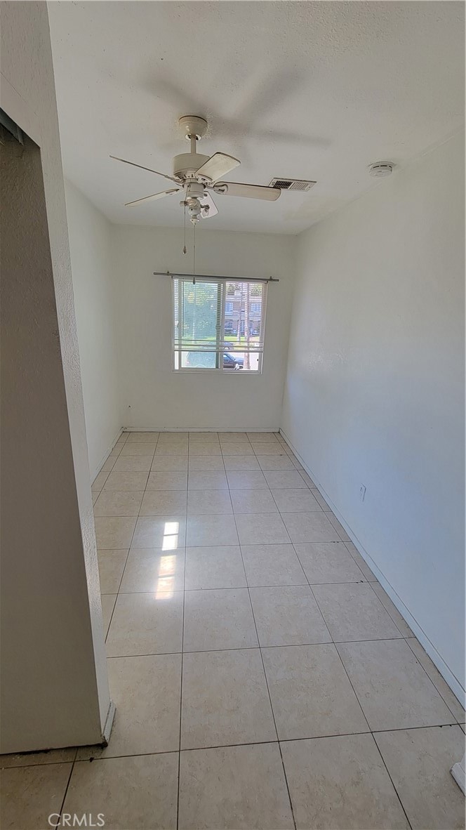 This is a small room for rent in a large two-bedroom house in San Bernardino. The rooms are rented to individual adults. The tenants have access to the kitchen use. There is an on-site coin laundry area, and private gated parking for an extra fee. Tenants pay for the utilities which include electricity, gas, internet, and twice a week common-areas cleaning. The room is on the second floor. It has tile floors, ceiling fan, AC, windows that provide plenty of day light.