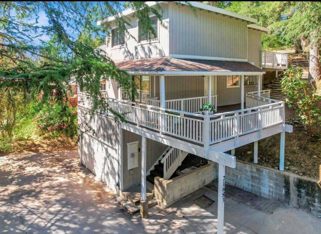 Beautifully remodeled and move-in ready! You'll enjoy new natural colored flooring throughout, a brand new kitchen with chic finishes complete with an island for cooking and entertaining. All new bathroom just waiting for its new owner. Incredibly convenient location with NO windy roads and a quick 9 minute drive to vibrant downtown Los Gatos. Unwind at the end of day on your wood deck overlooking trees. You will appreciate the hard work of almost all recently installed dual pane windows and fresh exterior and interior paint, Don't miss the indoor laundry and 2-car garage! Being part of Redwoods Estates, residents enjoy 2 community parks, sparkling pool, and benefits of the pavilion plus nearby pizza and bbq restaurant and convenience store. Top-rated Los Gatos schools. You could buy a townhome with high dues, but why when you have so much more here with a low-maintenance property! Sale is subject to CA Civil Code 2924 m/o.