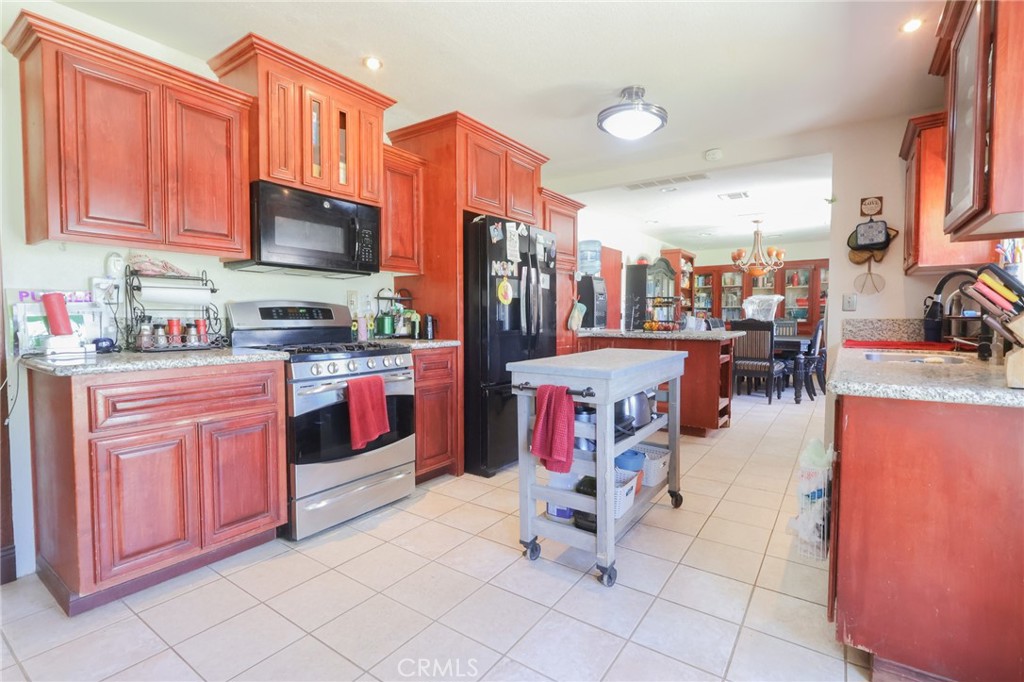 Create your ideal family compound with this exceptional property offering two separate homes on two private acres. Perfectly designed for multi-generational living, this setup provides both togetherness and independence. The spacious 1,675 sq ft main house features 3 bedrooms and 2 baths, a welcoming drop-down living room with a fireplace, and a large kitchen for family dinners. Enjoy peace of mind knowing the home is updated with a new leach line. The luxurious master suite includes a jacuzzi tub and two large closets. The second home offers a private haven for relatives, complete with an extra-large bedroom, its own bathroom, and two new mini-splits for year-round comfort. The expansive, fully-fenced property is a playground for all ages, featuring a newly installed commercial play structure and a zipline for kids. With multiple distinct areas for pets and hobbies, this property allows you to enjoy the benefits of shared land while providing everyone their own comfortable, updated, and private space.