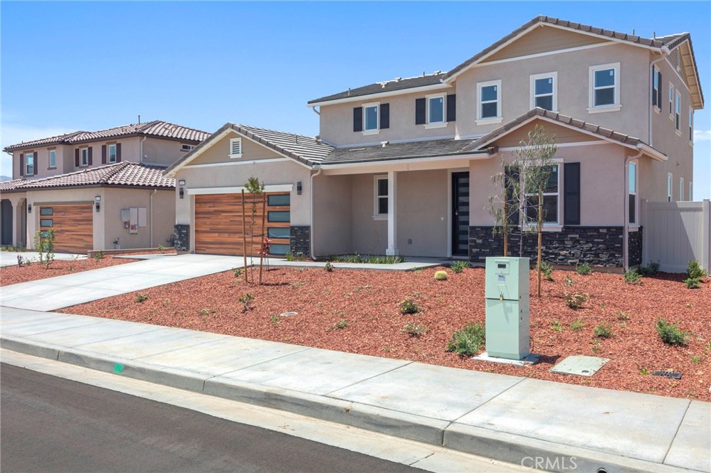 This brand-new luxury home is the perfect blend of high-end design, smart functionality, and unbeatable value—complete with fully paid-off solar panels! Nestled in a peaceful and quiet cul-de-sac, this modern masterpiece was built to impress. Step inside and experience the airy, open-concept layout filled with natural light, where rich hardwood floors and designer tile create a clean, sophisticated vibe. The heart of the home is a European-inspired chef’s kitchen featuring sleek cabinets, premium finishes, and seamless flow into the dining and living areas—ideal for entertaining or just enjoying everyday comfort. A stylish powder room is tucked away on the main floor, perfect for guests.
Upstairs, the wow factor continues with a dramatic glass-railed staircase leading to three spacious bedrooms, two luxe bathrooms, and a dedicated laundry room. The primary suite is a true showstopper with a custom walk-in closet and a spa-like bathroom featuring a European-style shower and elegant finishes. Designed for year-round comfort, the home features a high-efficiency 3-zoned HVAC system, keeping every room perfectly climate-controlled. And let’s not forget the stunning tile roof, adding durability and timeless curb appeal.
But that’s not all—this home includes a fully finished 2-bedroom, 1-bath ADU with its own private entrance, perfect for rental income, extended family, or a private home office setup. Outside, the backyard is a blank canvas for your dream outdoor space, and the two-car garage with custom doors completes the picture. Located just minutes from top shopping, dining, and the 60 freeway, this isn’t just a home—it’s your next level of living. Don’t wait—homes like this don’t last long!