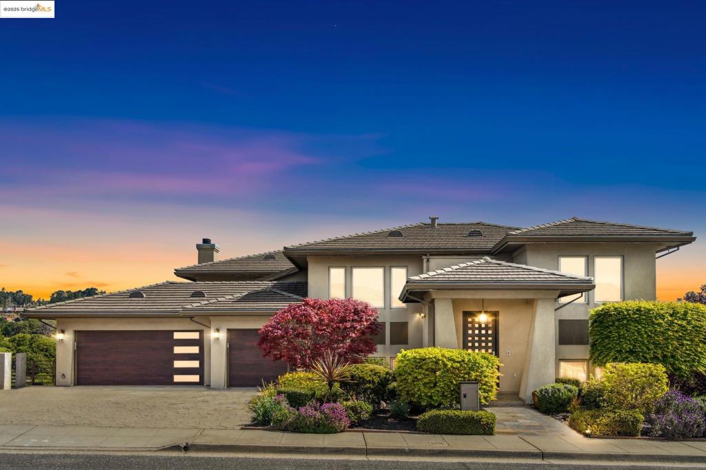 Nestled in the coveted Ridgemont neighborhood, this beautifully updated, split-level home offers the perfect blend of comfort, style, and function. Step into the newly renovated kitchen, thoughtfully designed with a generous island that anchors the open-concept layout—ideal for everyday living and effortless entertaining. Just off the kitchen, an expansive deck invites you to dine, relax, and host under the open sky. Upstairs, the primary suite serves as a peaceful retreat, complete with a private balcony that overlooks a lush, verdant backdrop. Throughout the home, you’ll find windows galore, flooding each space with natural light and highlighting the home’s warmth and charm. Five spacious bedrooms provide ample room for rest, work, or creativity, while multiple versatile living areas allow you to adapt the space to your lifestyle. For wine enthusiasts (and those who love to entertain), don't miss the dedicated wine cellar offering ample storage for your favorite vino. Whether you're enjoying the view from your bedroom balcony, entertaining on the deck, or unwinding in the sunlit living areas, this Ridgemont gem offers exceptional living in a serene setting.