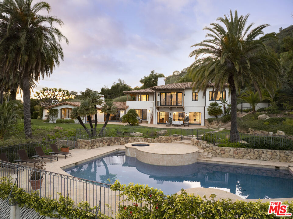 Sweeping ocean and mountain views take center stage from this extraordinary estate in Oak Creek Canyon. Set on 6+ private acres in the heart of Montecito, a sprawling renovated Spanish hacienda captures the essence of classic California living. Designed to embrace its incredible setting, the home offers romantic architectural details, exquisite formal rooms, a stunning primary suite with dual baths and closets, and sweeping ocean and mountain views from nearly every room. A luxurious guest house, pool terrace, and picturesque gardens complete this rare offering.